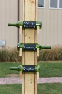 a wine rack made out of wood with four bottles on it and the words'whine tasting'written on them