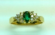 5 x 3 mm oval emerald0.30 CT emerald0.18 CT diamondOnly 1 left !!  Our beautiful green stone is called Emerald and it is in an oval shape . It is surrounded by 12 brilliant diamonds and placed into a gorgeous 14 K yellow gold ring . It is a very fine quality,natural stone . Available in ruby and sapphire upon request .Attention :We ship out items with USPS- mail or UPS Ground depending on location and requires the buyer's signature as well.Free Shipping in The USA ONLY !! Shipping outside of the Oval Green Hallmarked Diamond Ring, Hallmarked Green Oval Diamond Ring, Oval Green Diamond Ring Hallmarked, Green Diamond Oval Ring For Anniversary, Green Oval Diamond Ring For Anniversary, Green Oval Diamond Anniversary Ring, Green Emerald Oval Diamond Ring, Classic Green Oval Diamond Ring, Anniversary Green Diamond Oval Ring