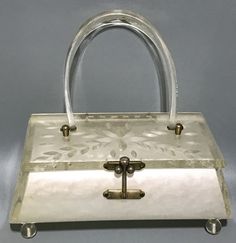 Add a touch of vintage glamour to your look with this stunning Lucite box purse by Charles S Kahn from Miami! The white pearl and flower design is perfect for a casual occasion or an Art Deco inspired outfit. Made in the United States, this original piece is a must-have for any fashion-forward woman! #vintagestyle #lucitepurse #charlesskahn #artdeco #madeinUSA 🌸💼✨ #shopvintage80 #orlandoestateliquidators #shopvintage  #eBay #eBayStore #CharlesSKahn #Lucite #Purse #ArtDeco #Women #eBaySeller Diy Purses, Dream Bags, Purse White, Diy Purse, Pearl Flower