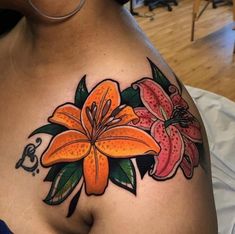 a woman's chest with flowers on it