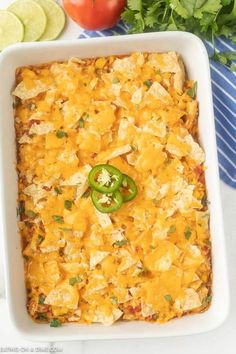 a casserole dish with chicken, cheese and jalapenos