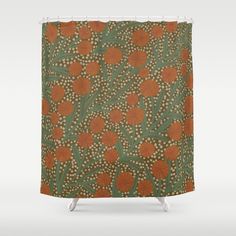 an orange and green shower curtain with flowers on it