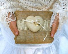 a person holding a heart shaped box in their hands