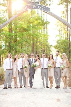 the wedding party is posing for a photo