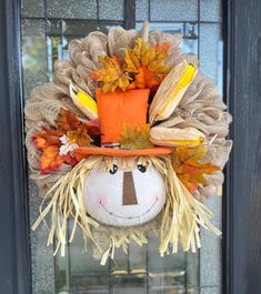 a scarecrow head hanging on the front door