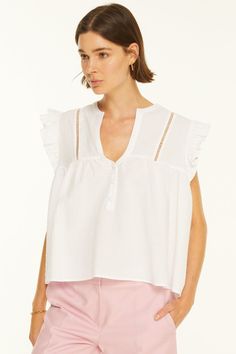 Altese Blouse is a cotton/linen blend top with the eyelet lace on the shoulders and ruffles at the sleeve opening. Relaxed Fit. Material: 80% Cotton 20% Linen. Model wears size 'S'. Feminine Summer Eyelet Blouse, Chic Sleeveless Eyelet Top, Chic Sleeveless Top With Eyelet Details, Chic Cotton Eyelet Blouse, Chic Cotton Blouse With Eyelet Details, Summer Pointelle Knit Tops For Daywear, Feminine Eyelet Blouse For Day Out, Chic Swiss Dot Tops For Day Out, Spring Linen Top With Broderie Anglaise