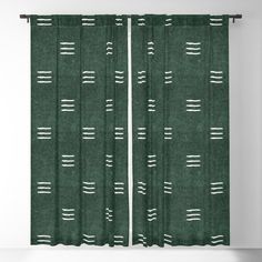 a green curtain with white lines on it