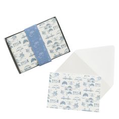 two envelopes with blue and white designs are open to show the inside of them