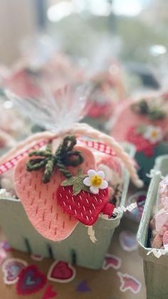 there are many small baskets with strawberries in them