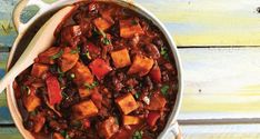 a bowl filled with chili and sweet potatoes