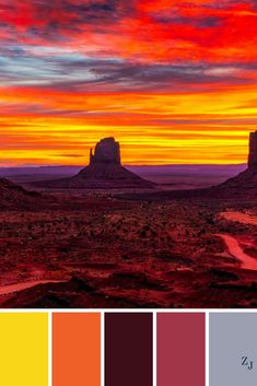 the desert with red, yellow and blue colors in it is shown at sunset or dawn