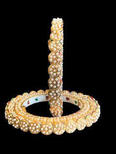 bangles fits size 24,2.6 made using shell pearls gold plated White Kundan Round Bangle, White Kundan Bangle, White Temple Jewelry Bangle For Diwali, White Temple Jewelry Style Bangle For Festive Occasions, White Temple Jewelry Bangle For Festive Occasion, White Temple Jewelry Bangle, White Temple Jewelry Bangle For Ceremonial Occasions, White Temple Jewelry Style Ceremonial Bangle, Festive White Temple Jewelry Bangle