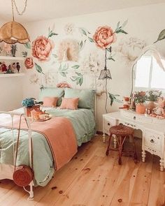 a bedroom with flowers painted on the wall