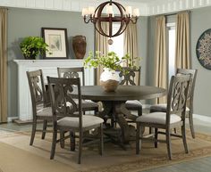 a dining room table with chairs around it