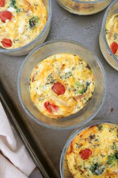 six muffins with tomatoes, broccoli and cheese