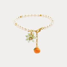 Orange Flower Pearl Bracelet is a high quality bracelet with an enamel paint flower and orange pendants. This is a fancy jewelry, and can be worn on any occasions. This fine jewelry is also a designer recommendation product on Selenichast Jewelry store. These delicate pieces of jewelry come from the Orange Pearl Bracelet collection. The design of lustrous strings of freshwater pearls dangling with enamelled orange pendants and orange flower offer women a vivid transcription of fragrance and cont Orange Fruit Jewelry, Citrus Jewelry, Cute Things To Buy, Fruit Jewellery, Wedding Guest Jewelry, Fun Products, Orange Jewelry, Orange Bracelet, Bracelet Pendant