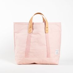 We wanted pink, but not the wrong pink. After many dye tests, Flamingo is the right pink.The classic Small East West Tote is the perfect size for your day’s goods (including a laptop), it’s durable, and the removable leather handles mean it’s also washable. DETAILS: Dimensions 13”H x 18”W x 5”D Leather Handle Drop: 4" Webbing Handle Drop: 11" Weight 1.3lbs (18oz) Materials: Cotton Canvas Undyed Leather Handles Hand-set Rivets and Handle Buttons Converts from handheld to shoulder with detachable leather handles Once the handles are removed, the tote is washable All seams are double stitched and bound with cotton on the inside One interior pocket Leather handles will patina over time with exposure to the sun and the oils in your skin CARE: Hand wash separately or turn inside-out Machine wash Copper Hardware, Skin Hand, Stitch Lines, Quilted Totes, Mean It, Childrens Gifts, Day Bag, East West, Leather Handles