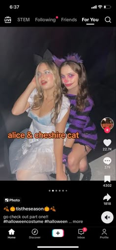 two girls dressed in costumes posing for the camera