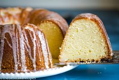 a bundt cake on a plate with one slice cut out