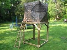 a wooden structure with a camouflage covering on it