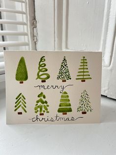 a card with christmas trees on it