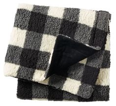 black and white checkered blanket folded on top of each other