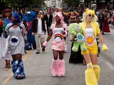 three women in costumes walking down the street