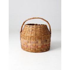 a woven basket sitting on top of a white table