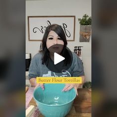 a woman holding a blue bowl with the words butter flour tortillas in front of her face