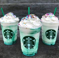 three starbucks drinks with sprinkles on them