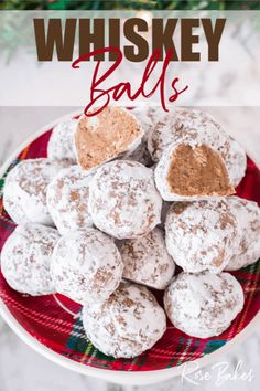 a red plate topped with powdered sugar covered donuts next to a christmas tree