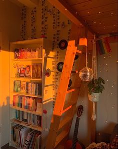 a room with a ladder and bookshelf next to a wall full of cds