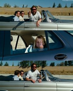 two men and a woman sitting in the back of a car