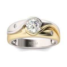 a white and yellow gold ring with a diamond