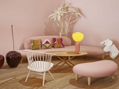 a living room filled with furniture and pink walls