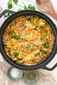 an overhead view of a casserole dish with broccoli and other ingredients