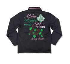 a black jacket with green shamrocks and the words, apha applique on it