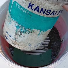 there is a bucket with some paint in it