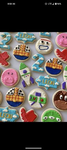 some decorated cookies are sitting on a table