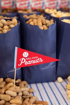 peanuts are on display in blue bags with a red flag sticking out of one bag