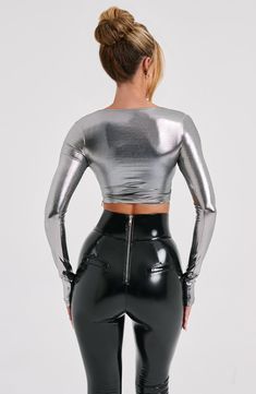 Our metallic Kyranni top oozes glamour, made from a luxe semi sheer jersey that moulds to your body figure for the dreamiest fit. The top has long sleeves, flattering high neckline and looks amazing worn over the Macy bralette with the Cassidy pants.


Colour: Gunmetal.

Metallic semi sheer jersey.

Long sleeves.

High neck.

Moulds to body figure.

Cropped length.

Model is an XS and is wearing an XS.

 Size: XS, S, M, L, XL, XXL Homecoming Dresses Corset, Silk Crop Top, Maxi Dress Sale, Sparkle Dress, Cropped Tops, Dresses By Length, Formal Dresses Prom, Flowy Dress, Prom Party Dresses