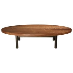 an oval wooden table with metal legs