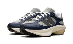 The New Balance WRPD Runner “Navy” is a navy-based colorway of the future-forward looking sneaker The WRPD Runner (read: Warped Runner) debuted in 2023 and is inspired by New Balance’s past and future.  Here, the “Navy” features a grey mesh base that’s contrasted with Navy leather overlays.  An oversized dark grey “N” logo is seen on both sides.  The WRPD Runner’s futuristic-looking midsole has signature FuelCell cushioning for all-day comfort. Navy Sneakers With Vibram Sole For Streetwear, Modern Blue New Balance Sneakers, Sporty Navy New Balance Sneakers, Navy Low-top Running Shoes With Boost Midsole, Navy Low-top Functional Sneakers, Functional Navy Low-top Sneakers, Navy Functional Low-top Sneakers, Navy Sports Sneakers With Vibram Sole, Navy Sneakers With Boost Midsole For Light Sports