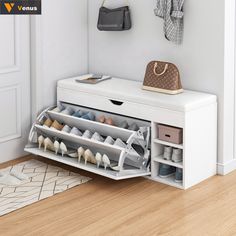 a white shoe rack with shoes and purses on it in front of a wall