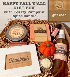 a gift box filled with soaps, candles, and other personal care items for thanksgiving