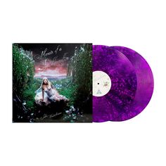 two purple colored vinyl records with an image of a woman sitting on the ground in front of