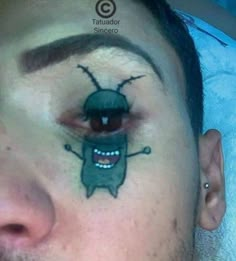 a man with his face painted like a bug