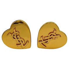 YVES SAINT LAURENT vintage gold tone heart shaped clip-on earrings embossed with a YSL logo. Embossed YSL Made in France. Indicative measurements : max. height approx. 3.3 cm (1.30 inches) / max. width approx. 3.3 cm (1.30 inches). Weight per earring : approx. 13 grams. Material : Gold tone metal hardware. NOTES - This is a preloved vintage item, therefore it might have imperfections. - Colors may differ slightly from actual product appearance due to differences in lighting conditions. - As a bu Saint Laurent Vintage, French Clip, Lapis Lazuli Earrings, Ysl Logo, Colorless Diamond, Heart Logo, Vintage Lucite, Cross Designs, Gold Tone Metal