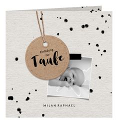 a baby's photo hanging from a tag with the words, enlighting our tauke