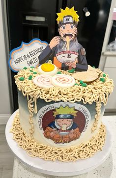 a birthday cake decorated with an image of naruto and ramen noodles